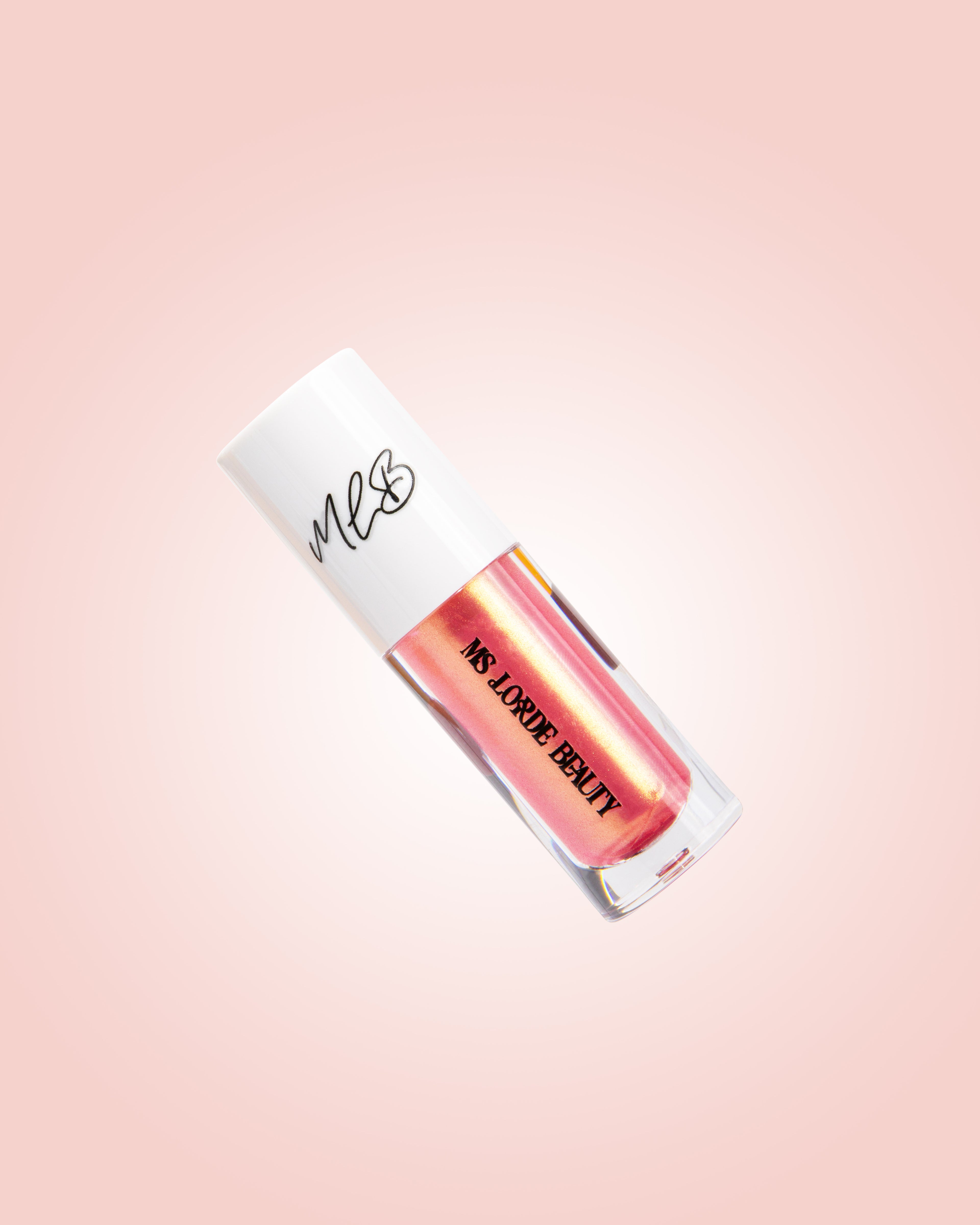 Lip gloss with 'MS. LOVE BEAUTY' branding on a gradient pink background